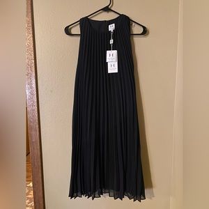 Halston Heritage black pleated dress.